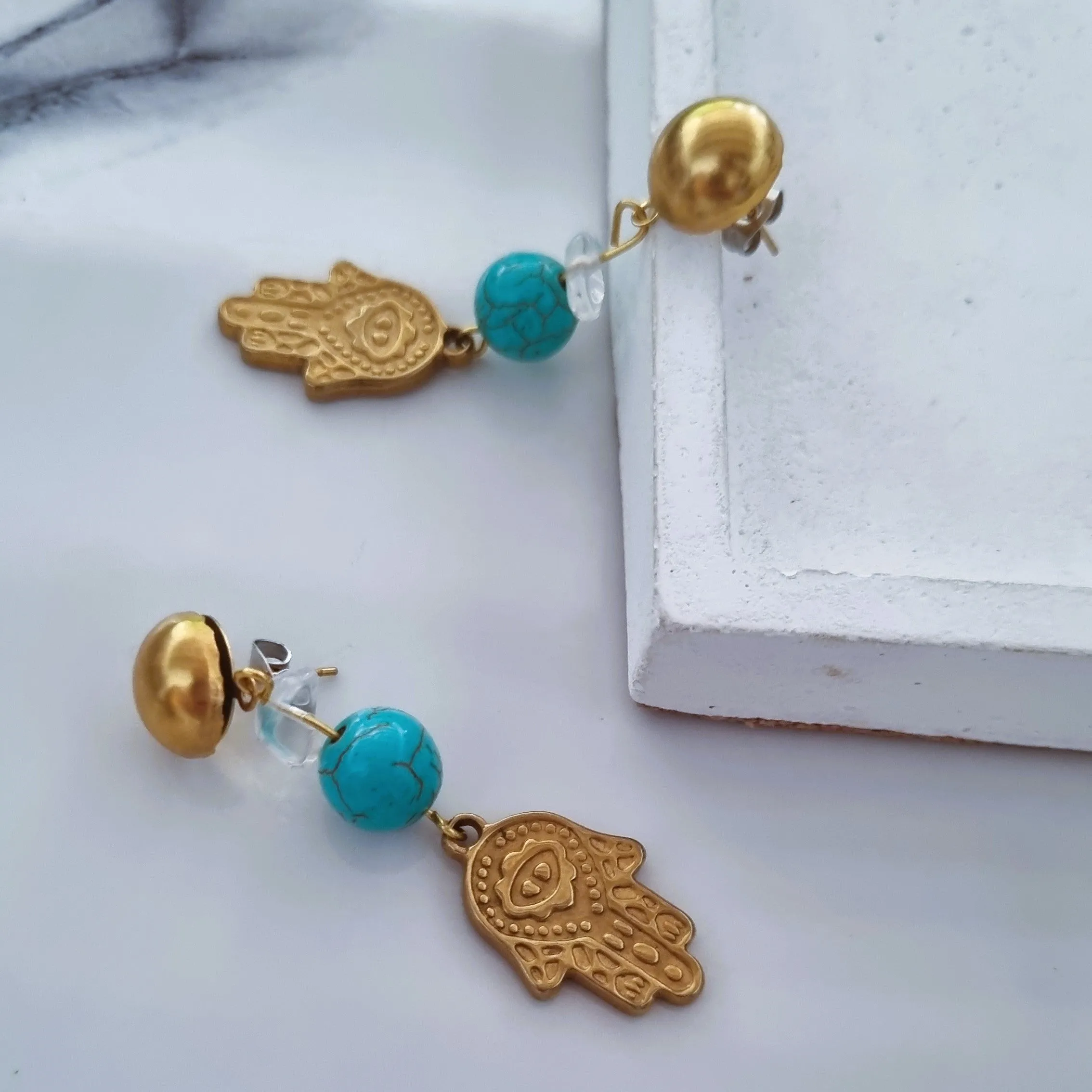 Hamsa earrings in blue