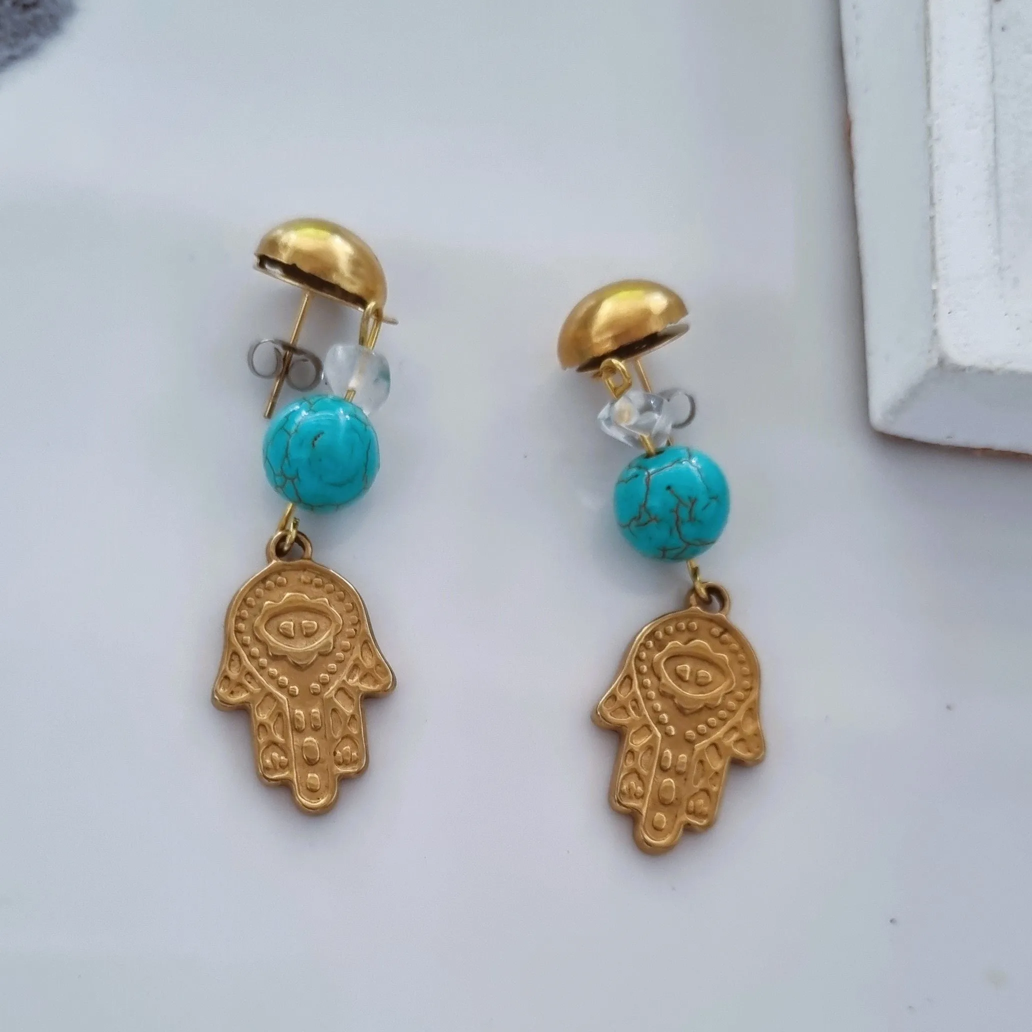 Hamsa earrings in blue