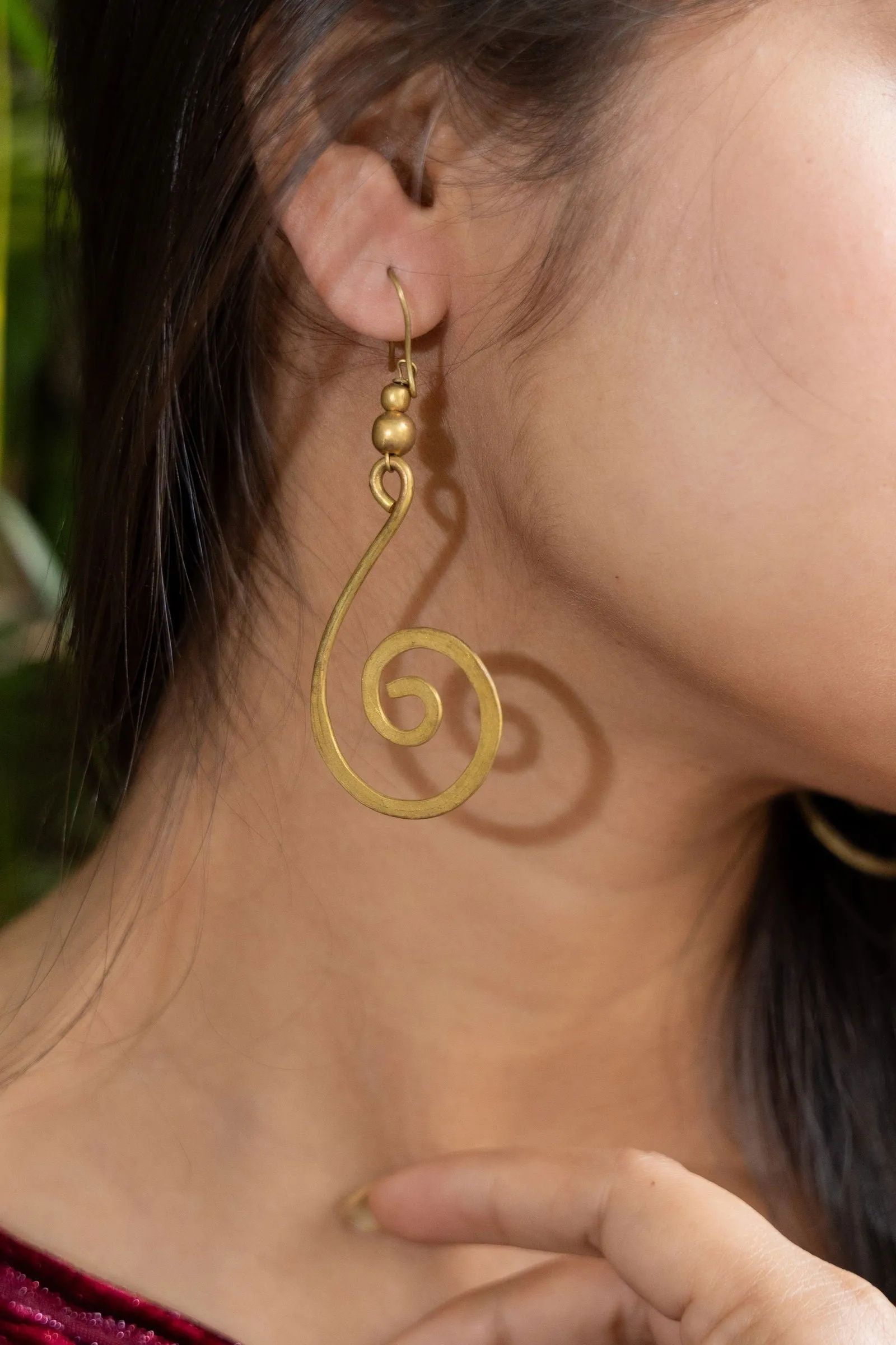 Handmade Dokra Brass Crescent Spiral Earrings - Unique Artistry with Intricate Design